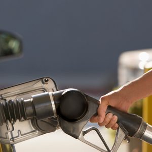 Woman pumping gas