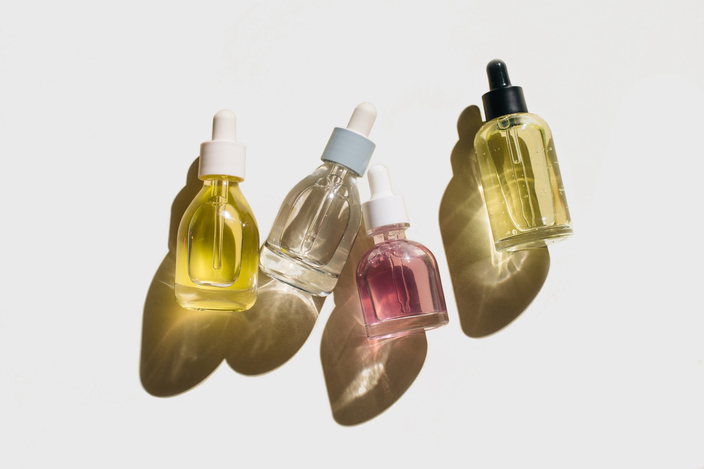 flat lay of Glass bottles for cosmetic products with pipette