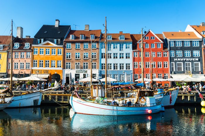 Copenhagen Nyhavn panorama city crowds enjoying sunshine restaurants bars Denmark