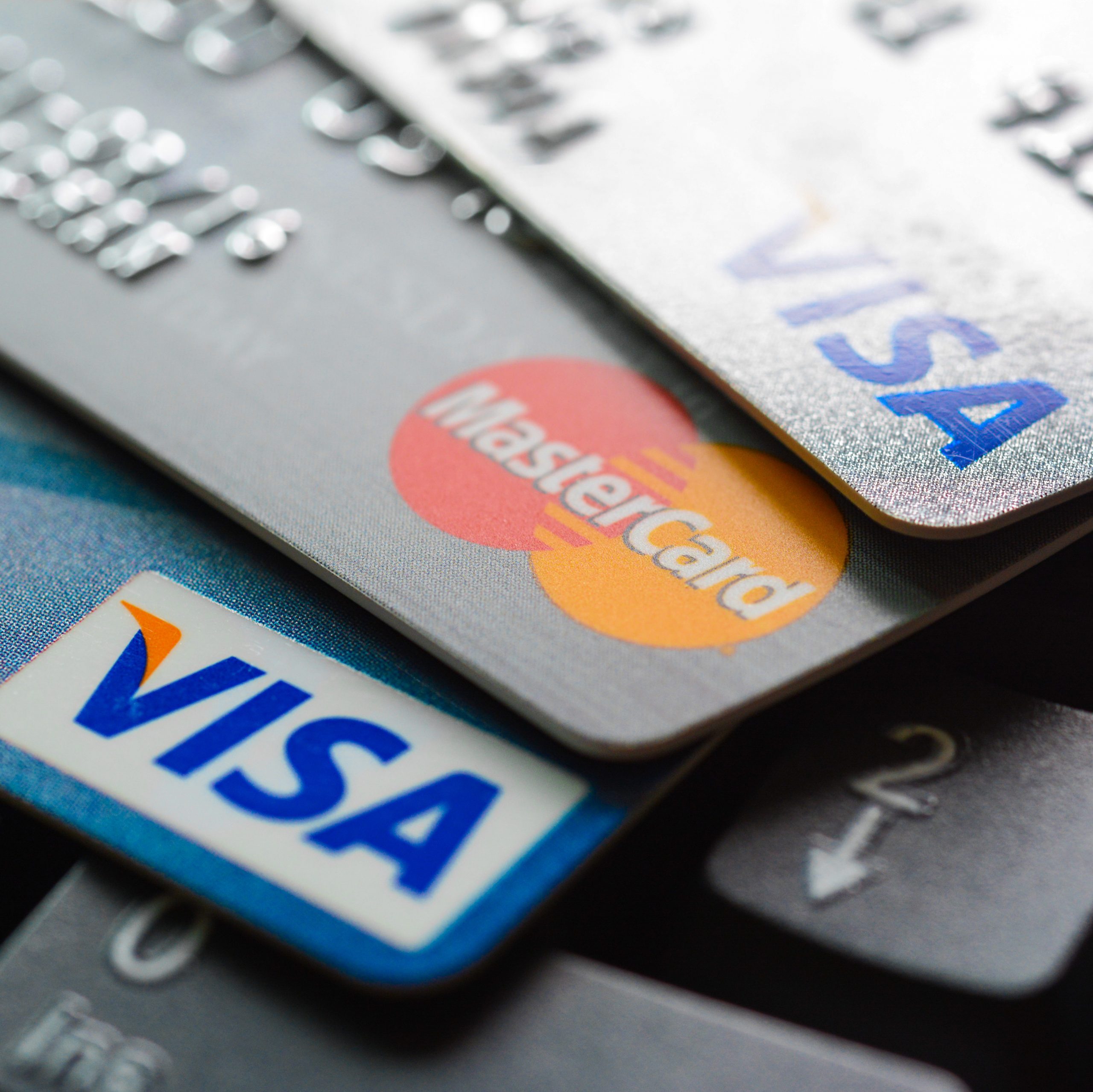 Group of credit cards on computer keyboard