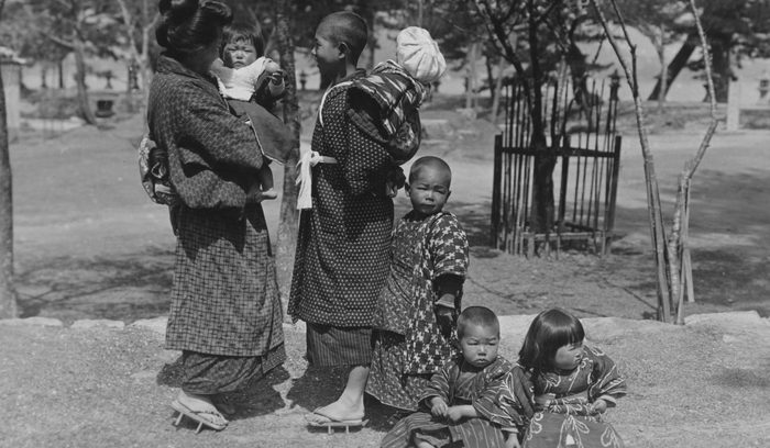 Woman With Infant And Children.