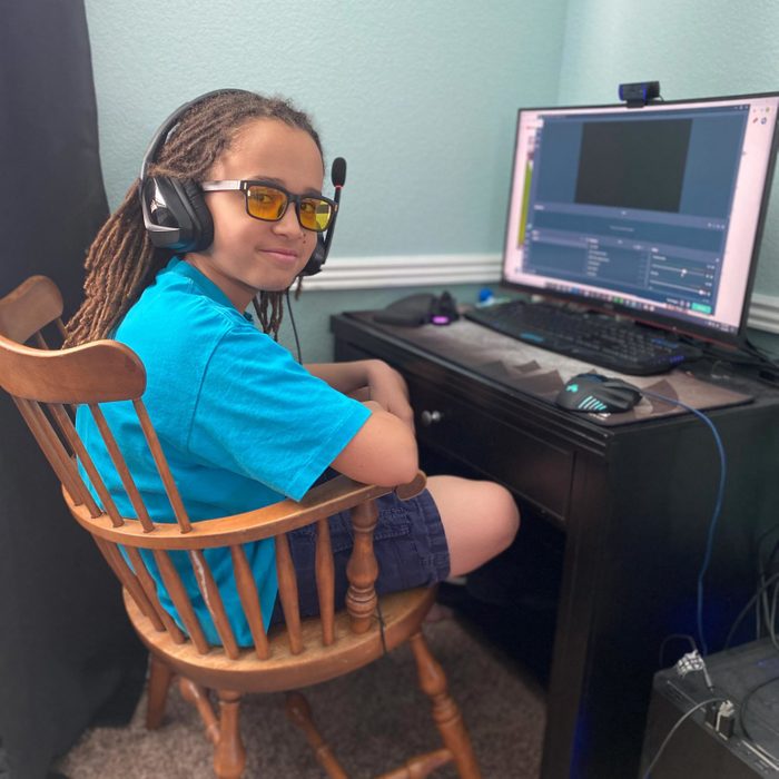 one of the horne children at his desk at home