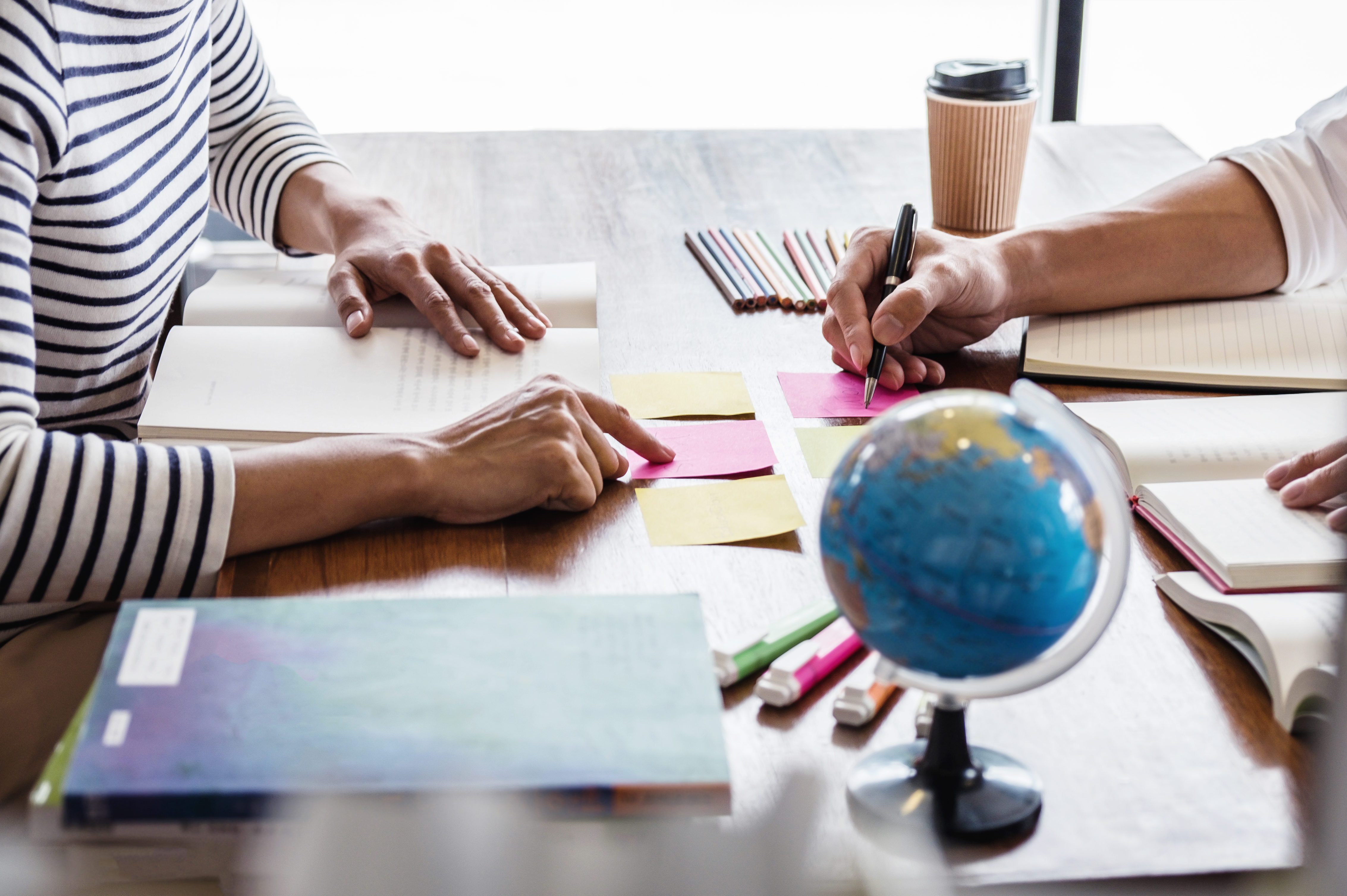 High Angle View Of Business People Working On Table