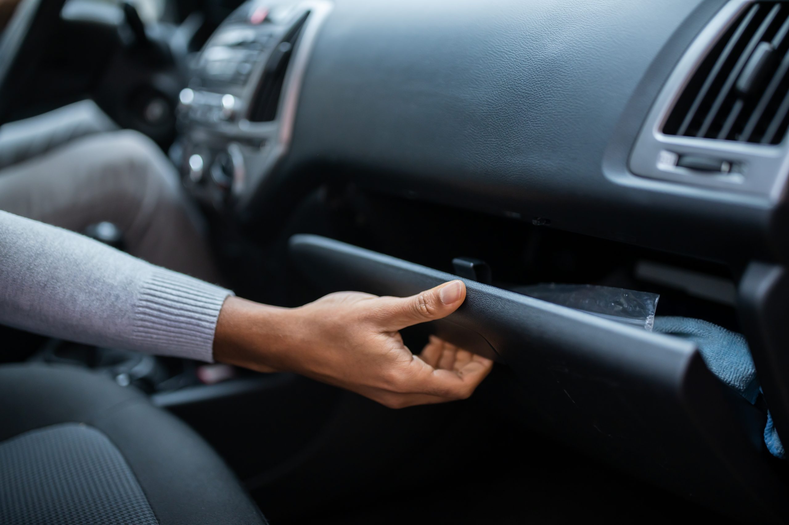 Driver Opening Glovebox Compartment