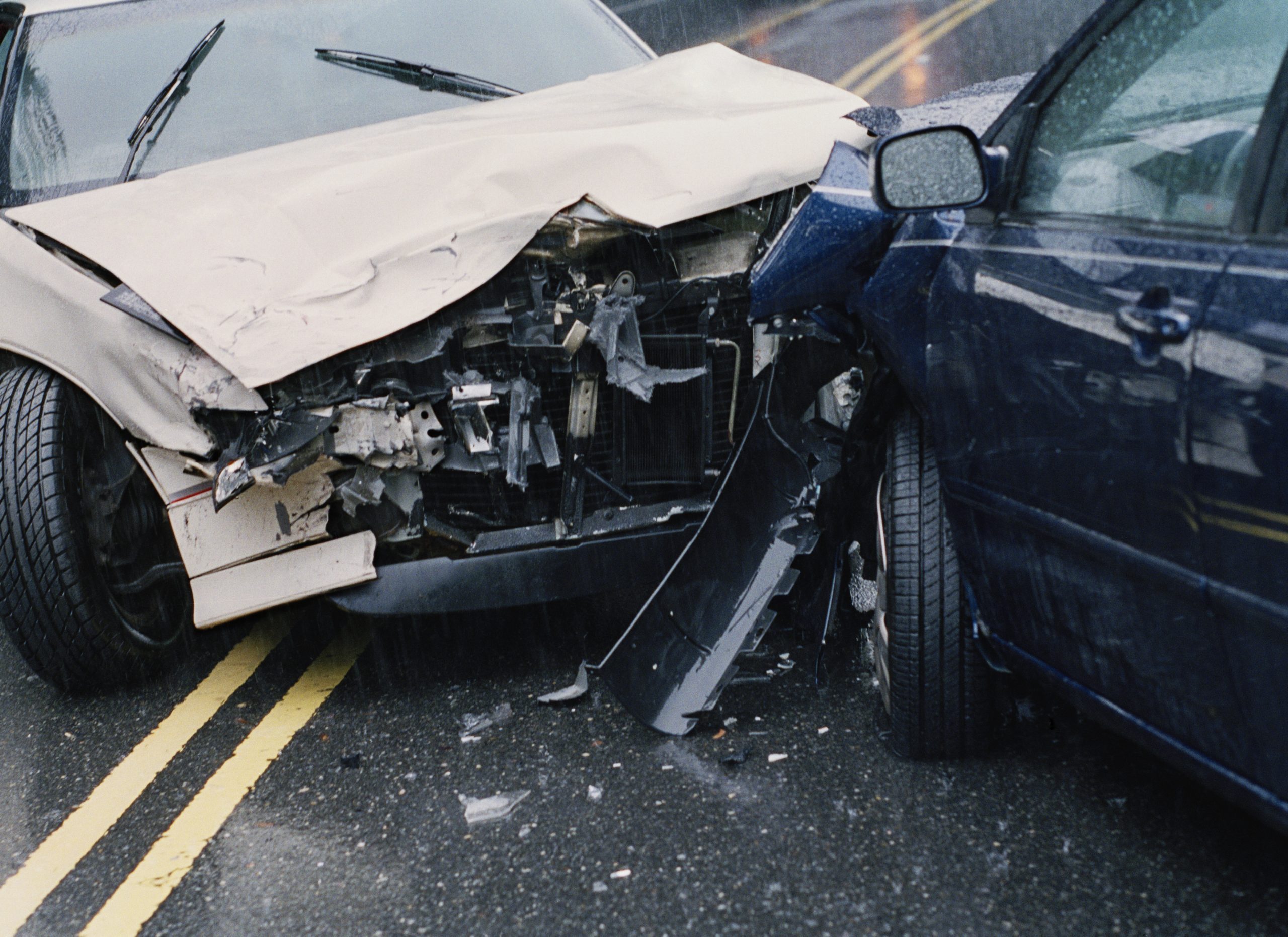 Two damaged cars after crash, close-up