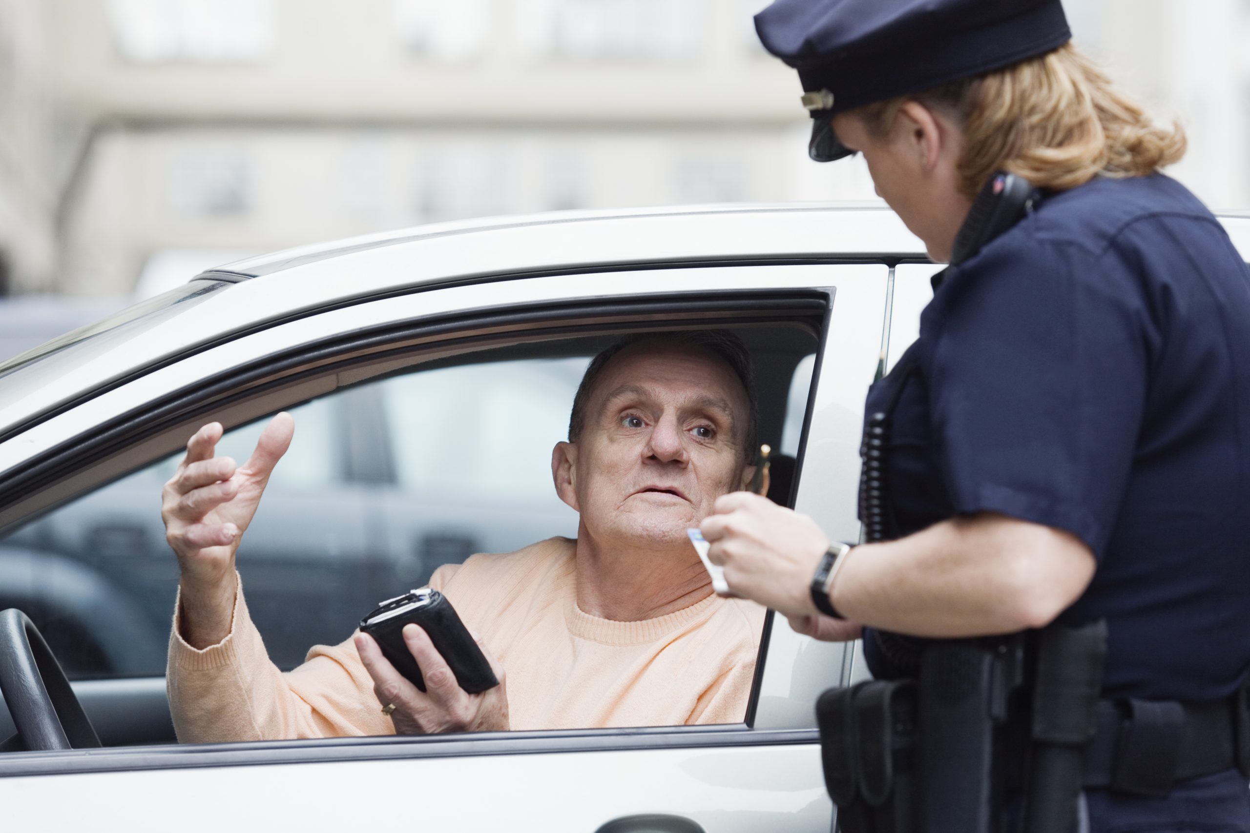 Policewoman interrogating a man