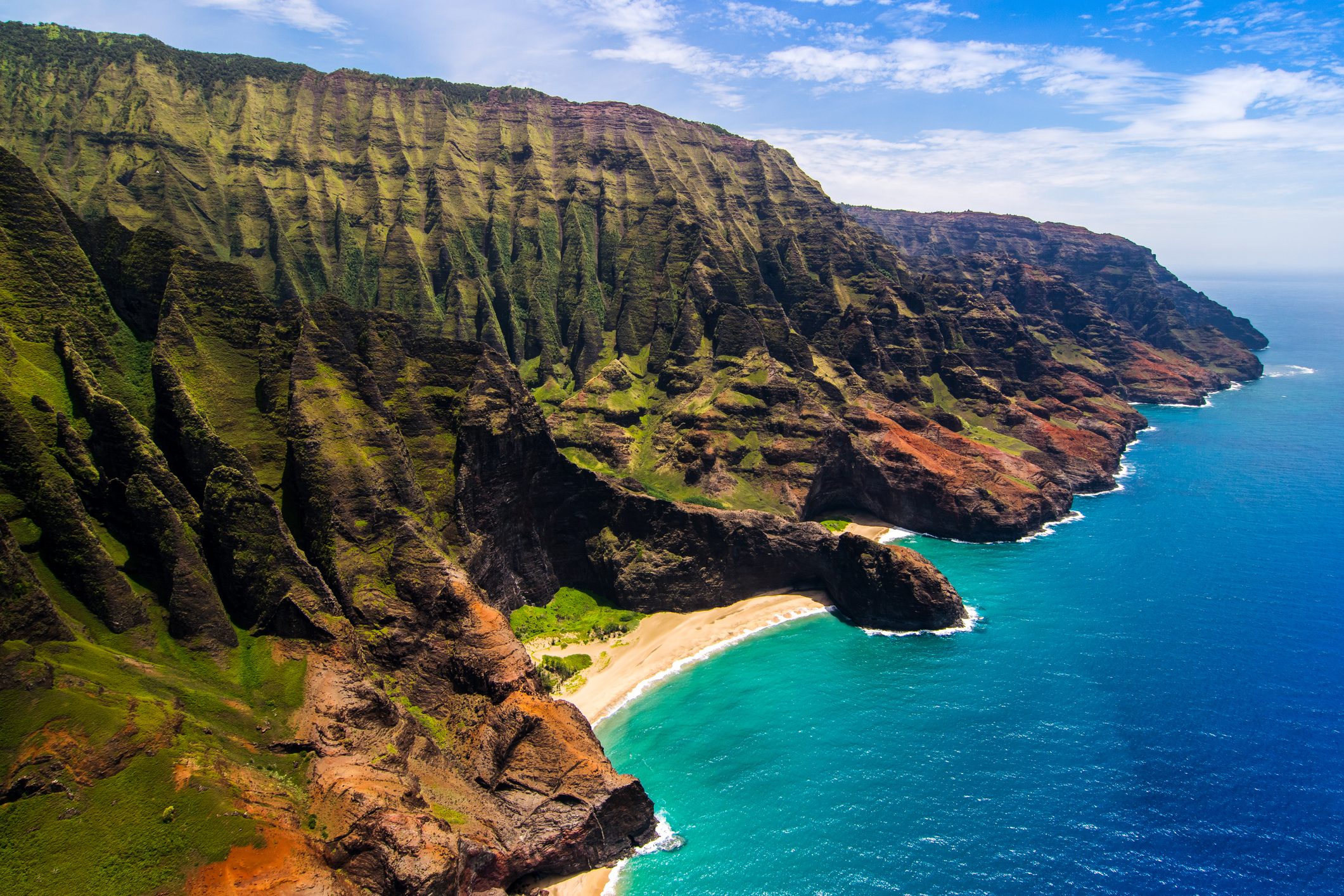Aerial landscape view of Honopu Arch, Na Pali coastline, Kauai
