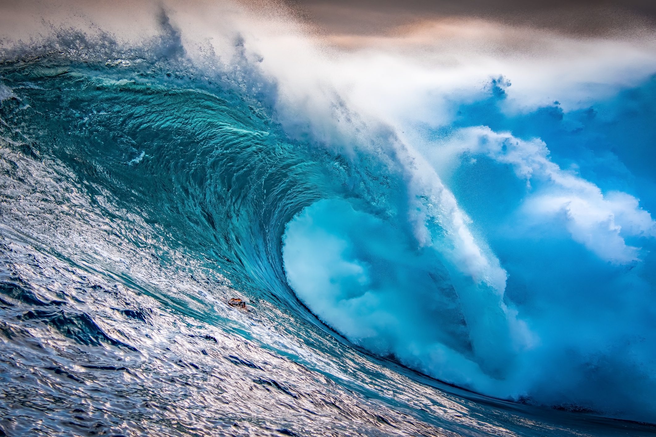 Big wave breaking at sunset