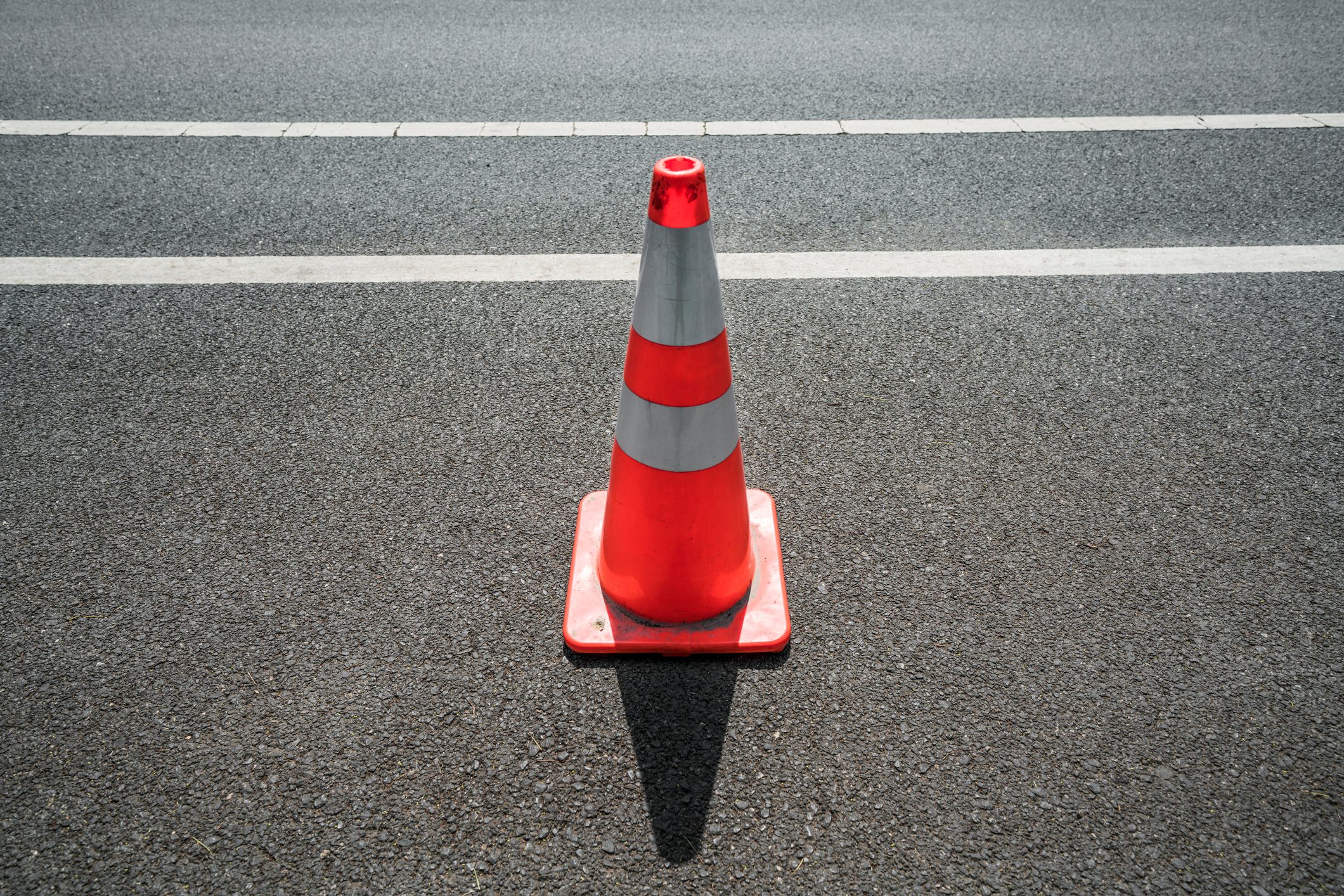 Traffic cone,an image of cautions on asphalt road