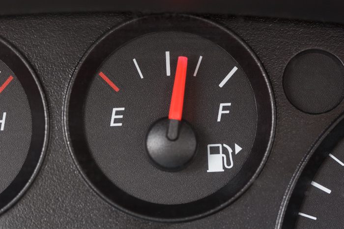 Black Fuel Gauge with Red Marker Over Half Full