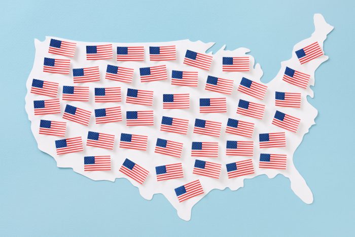 American flags over US map