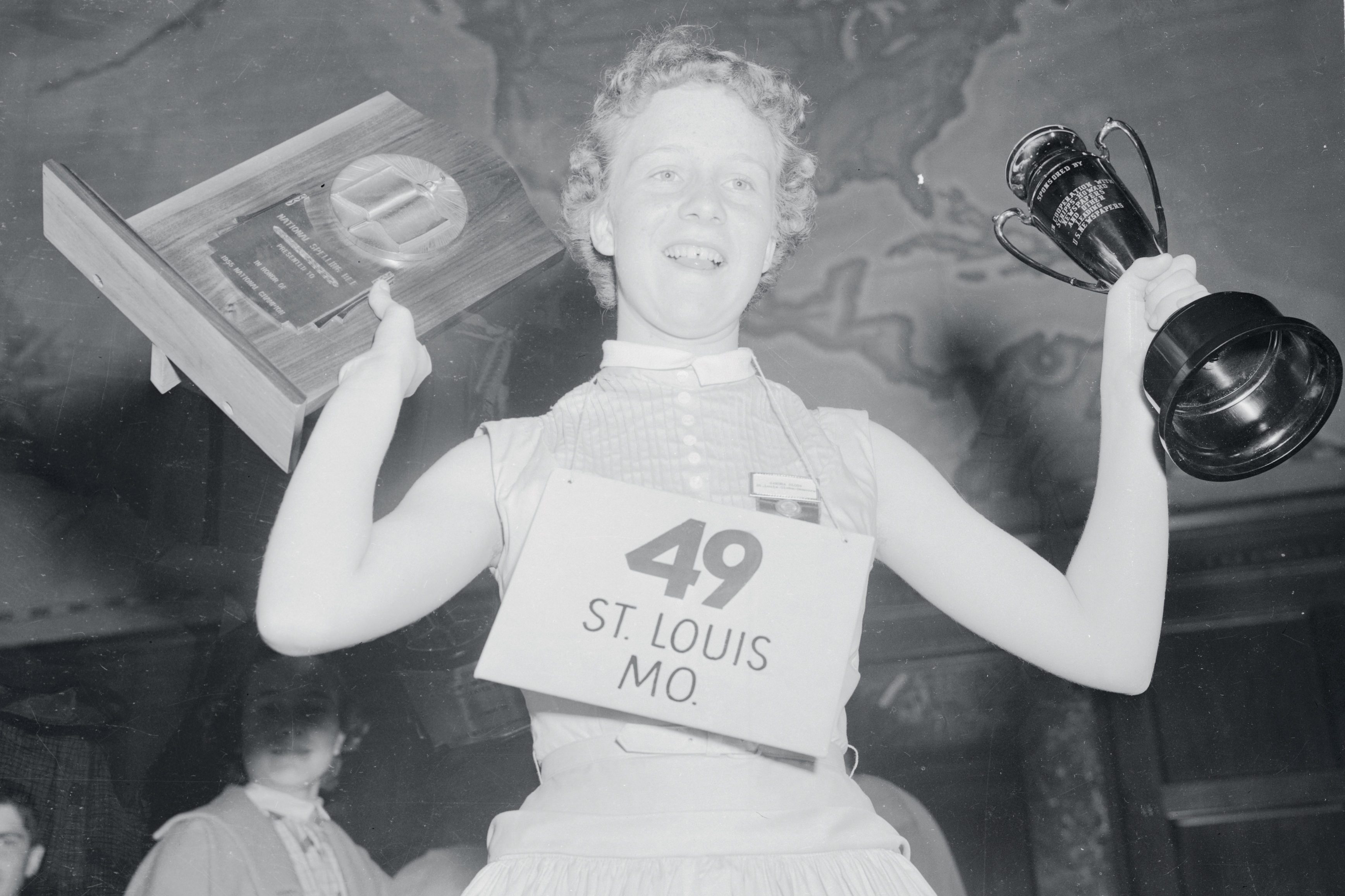 Girl Holding Trophy Cup and Plaque