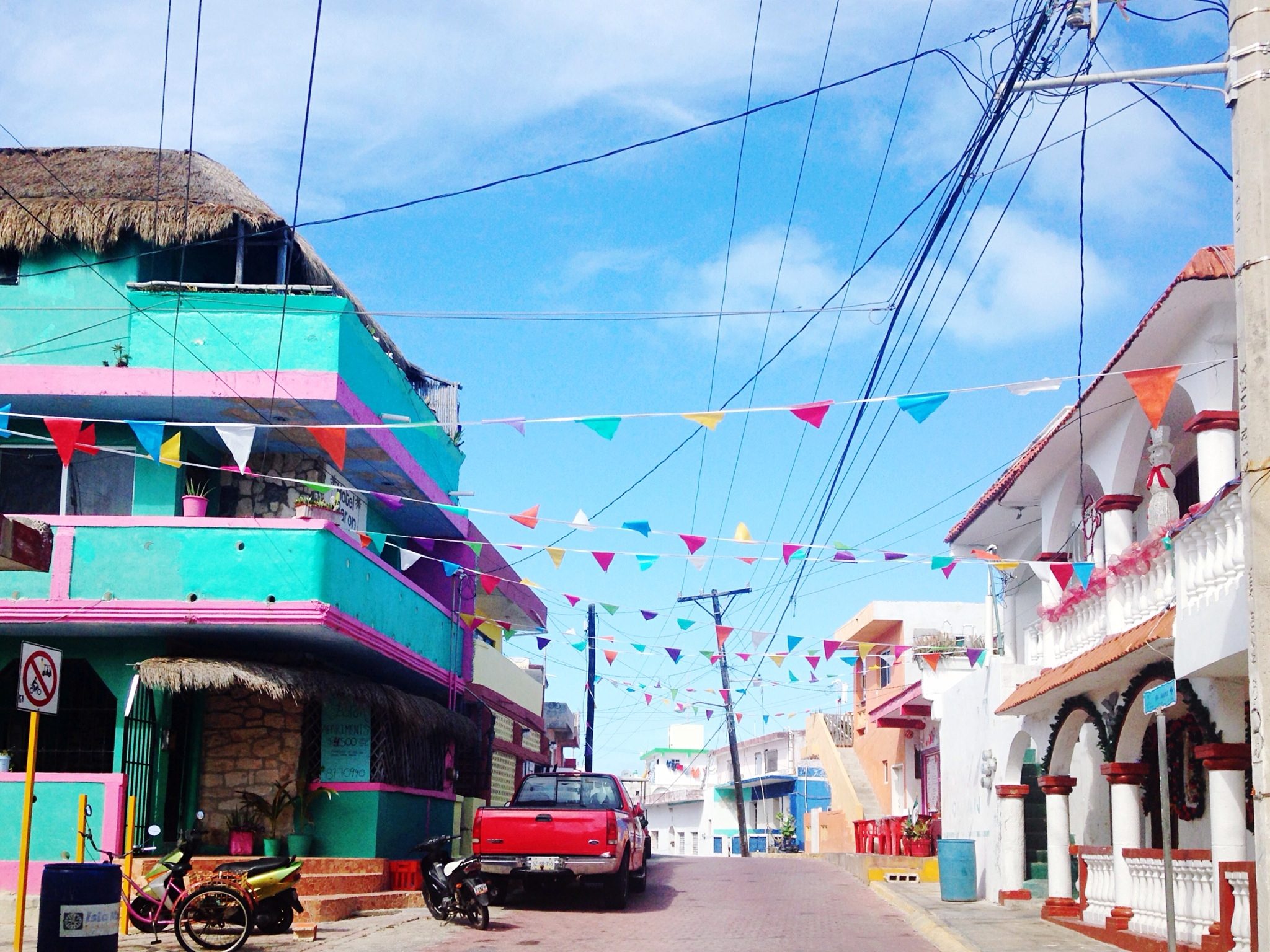 Prayer Flag Hanging Amidst Buildings In City