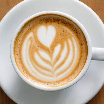 View of coffee cup with latte art straight from above