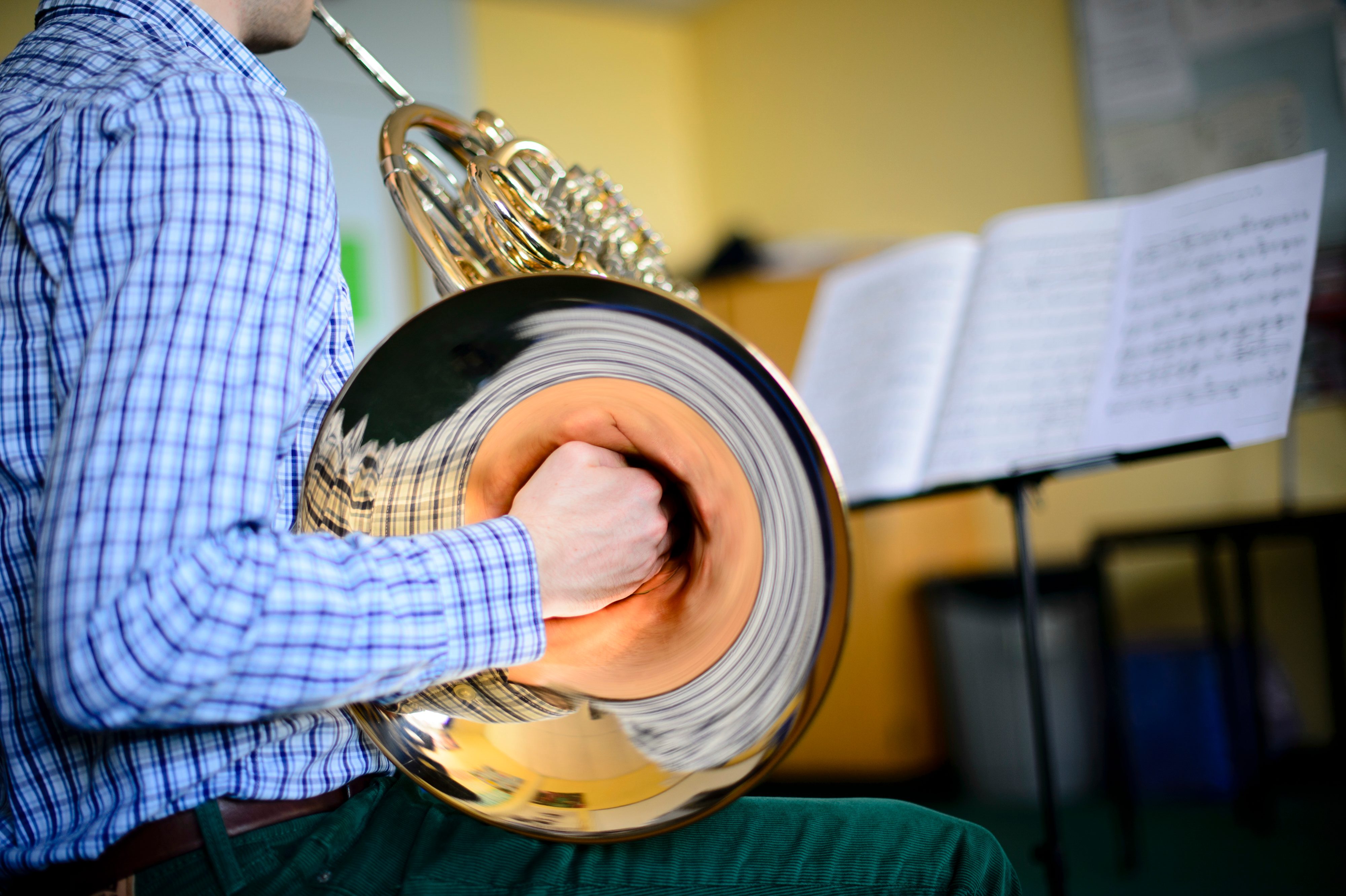A Young male musician practicising french horn, part of Aberystwyth Arts Centre's MusicFest 2014