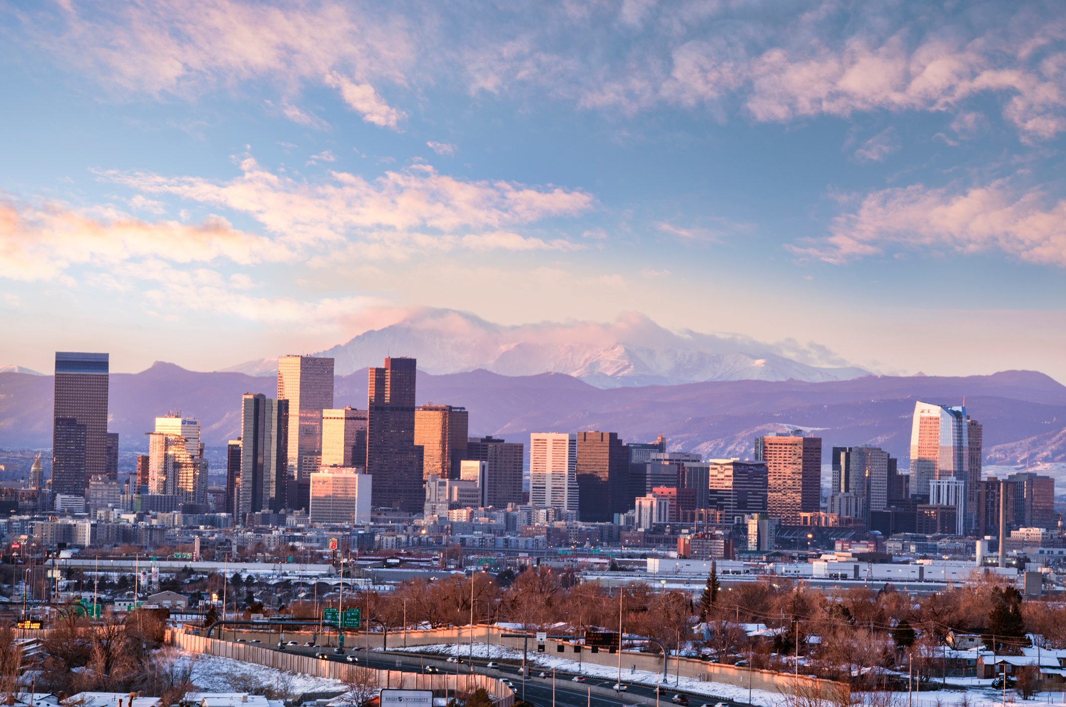 denver cityscape with moutains in the background