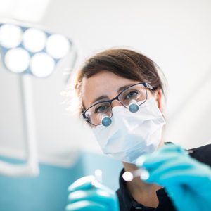 Dentist treating patient in medical clinic