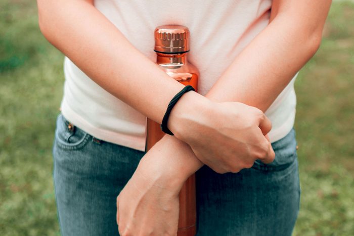 black hair tie on woman's wrist