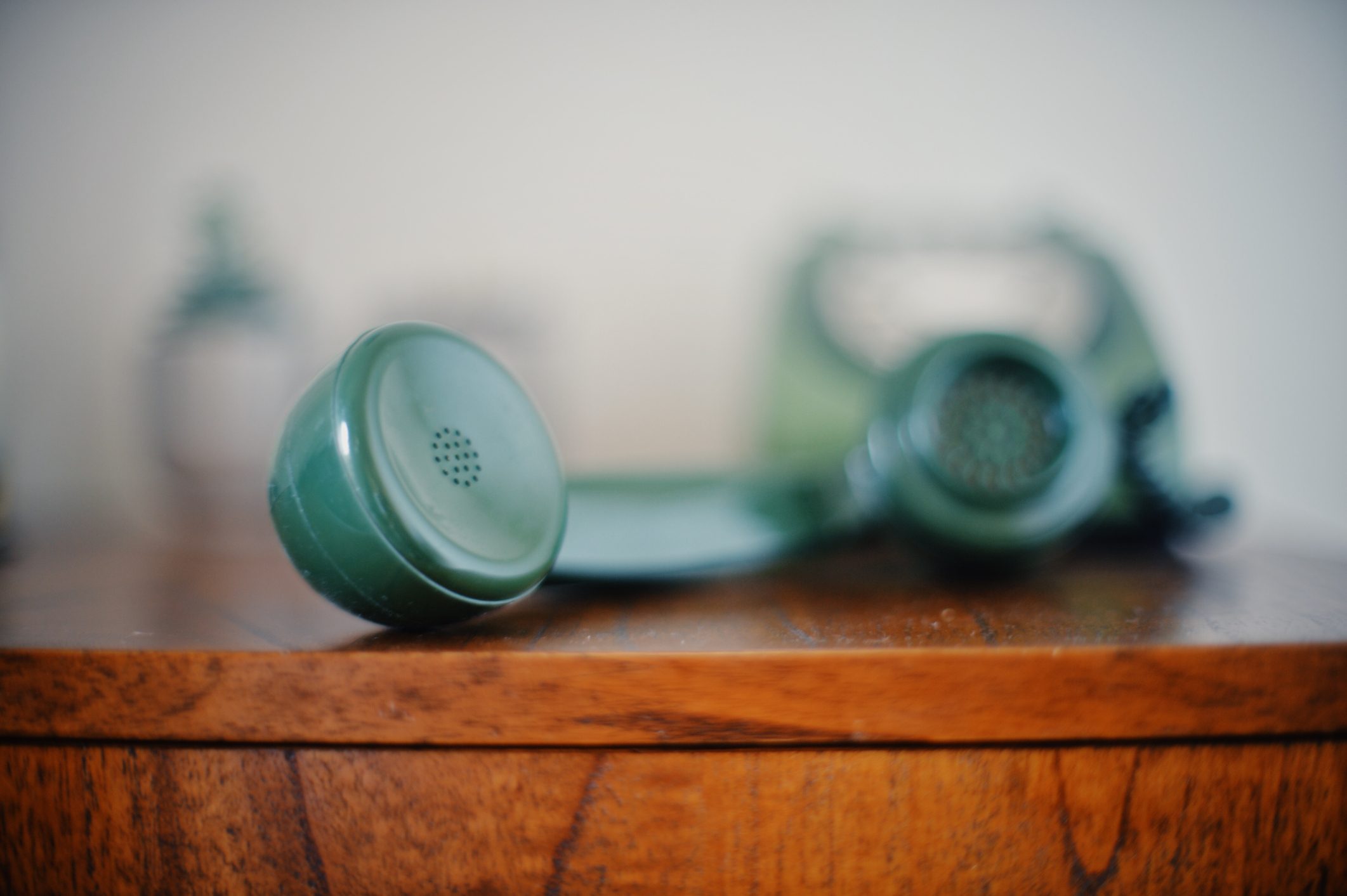 Old green telephone handset receiver