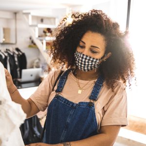 Woman shopping protecting herself wearing protective mask