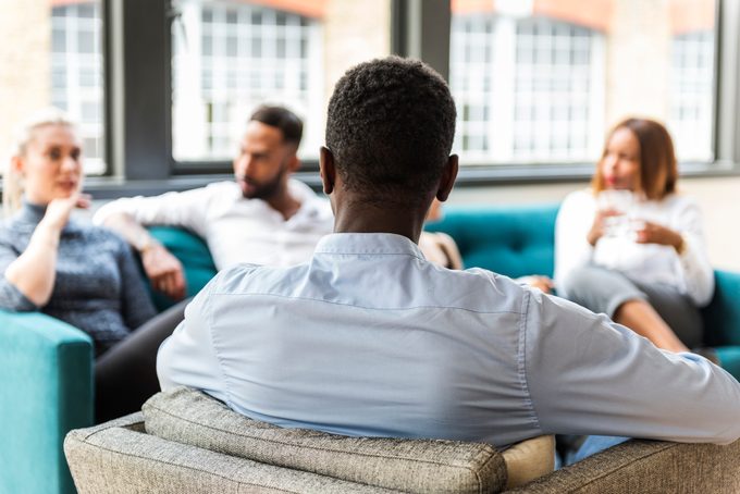 Team of corporate professionals having friendly discussion