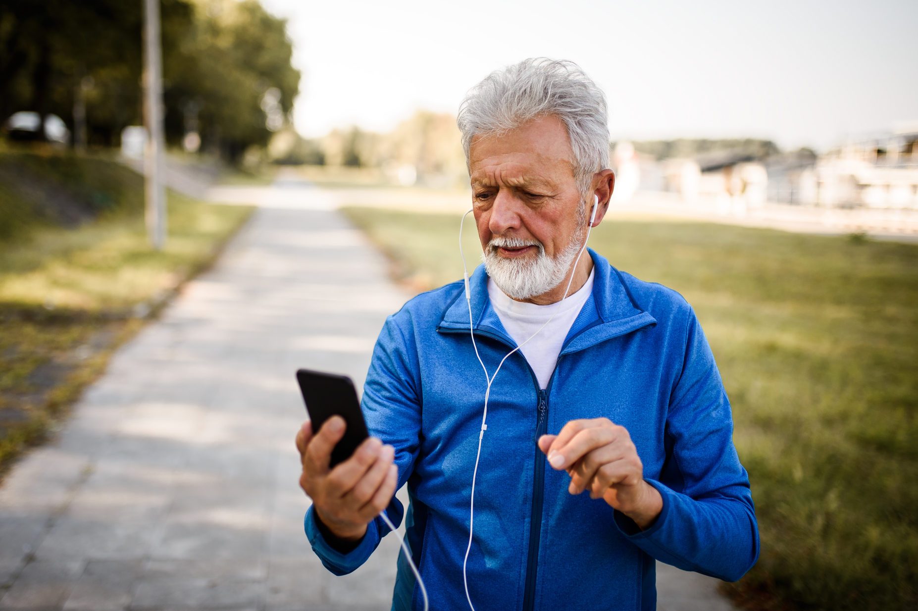 Senior man using mobile phone.