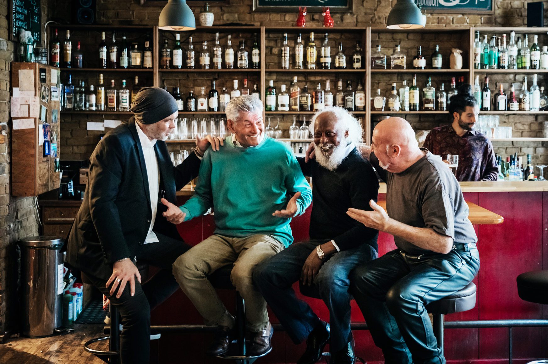 Group Of Friends Drinking In Craft Beer Bar