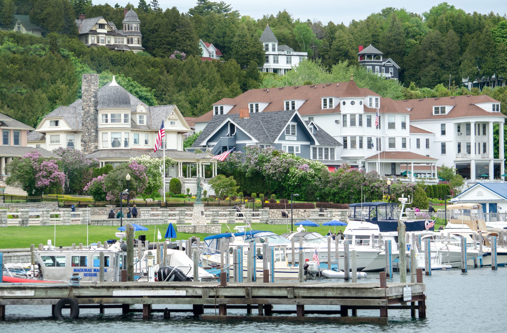 Houses By River And Buildings In Town