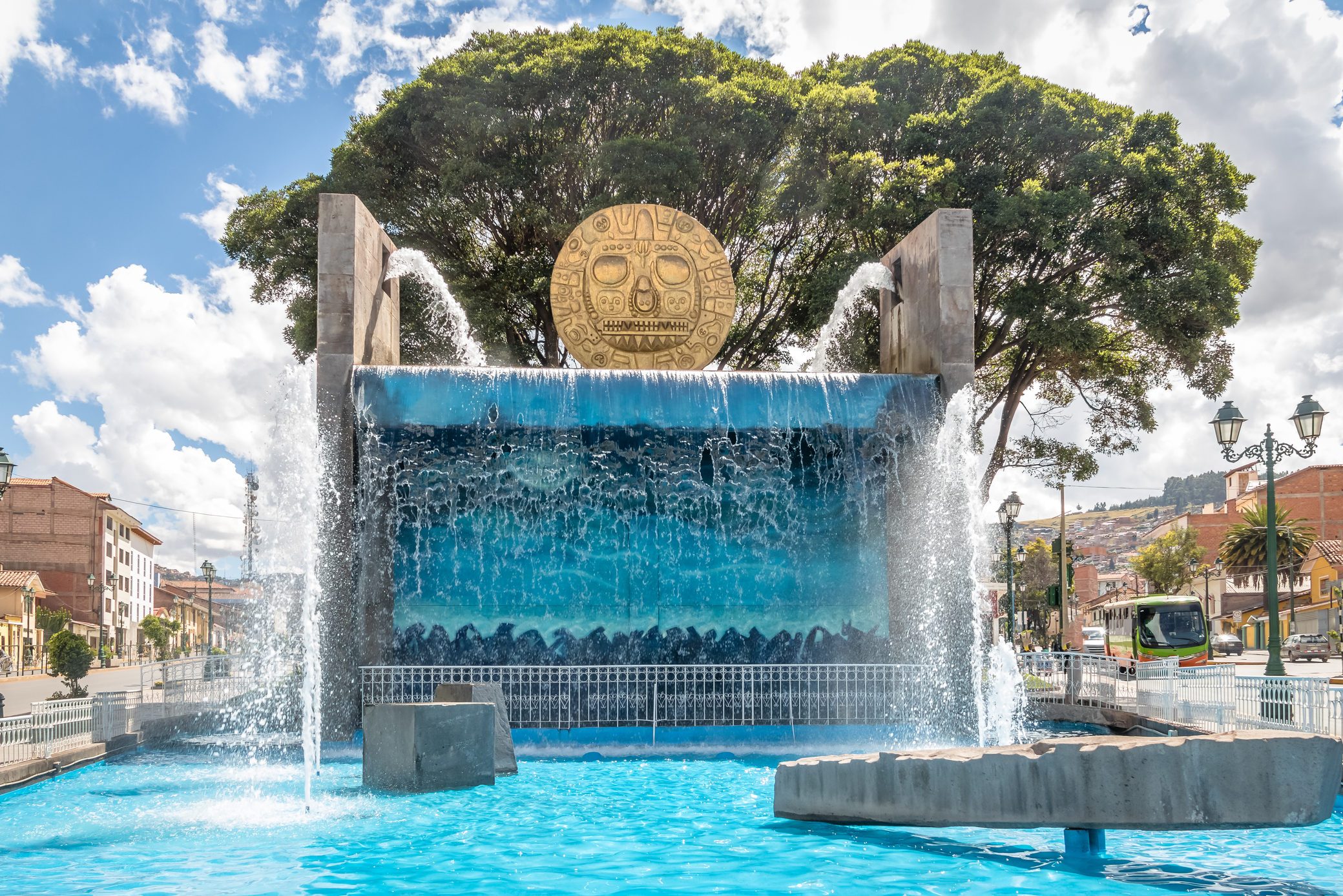 Water fountain monument with Golden Inca Sun Disc in the streets of Cusco City - Cusco, Peru