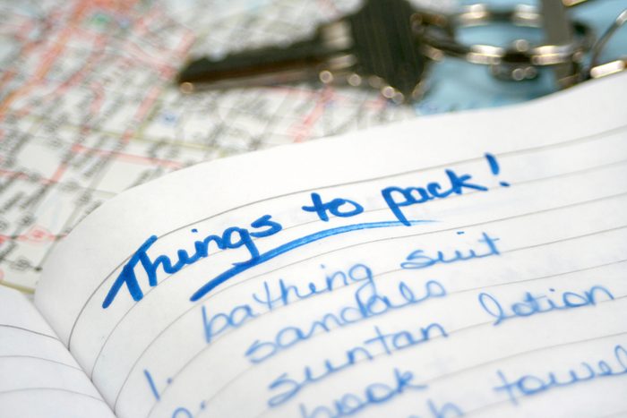 Handwritten reminder list on lined paper for holiday packing