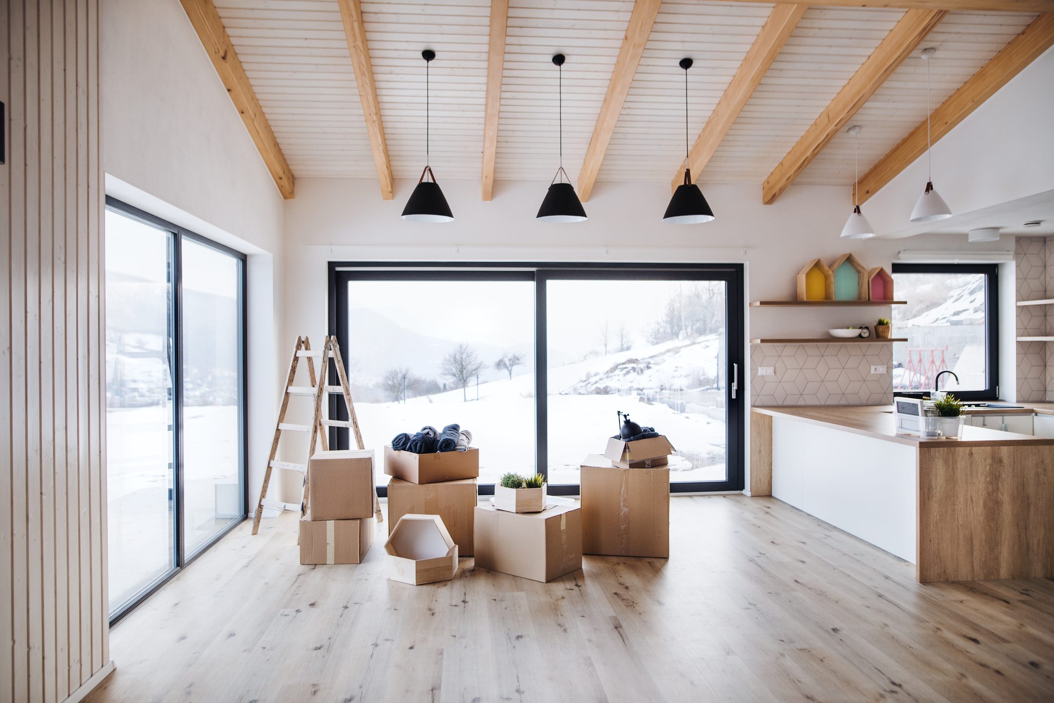 Moving boxes in modern living room in a new home.