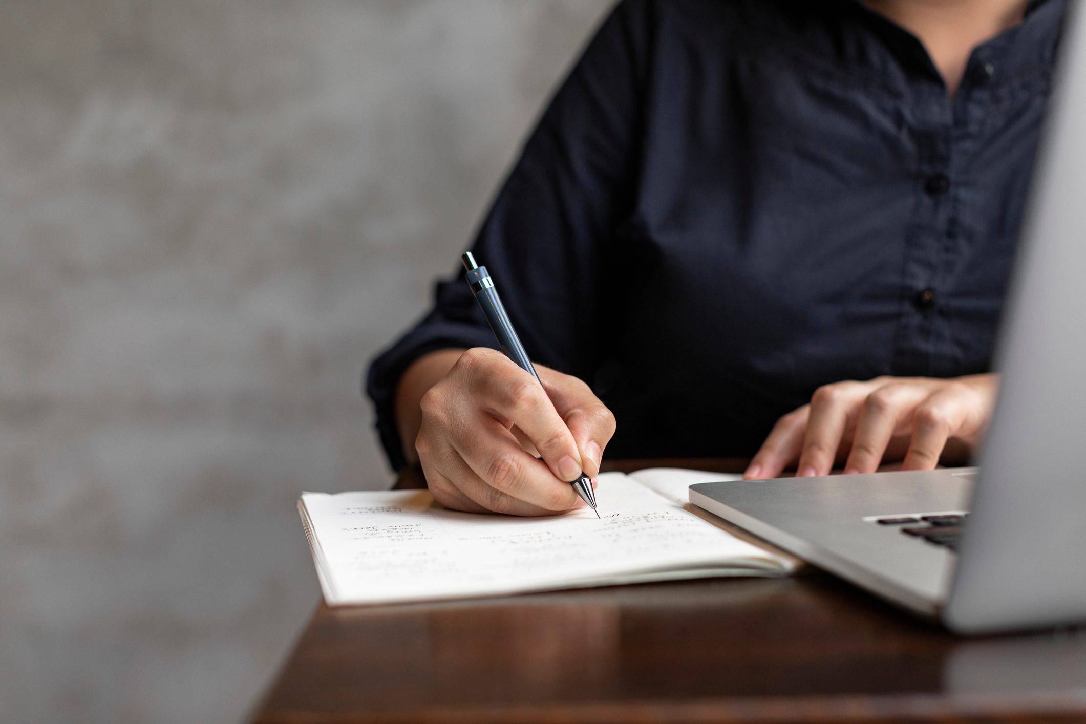 Hands of a Businesswoman Working at a Cafe, a Close Up