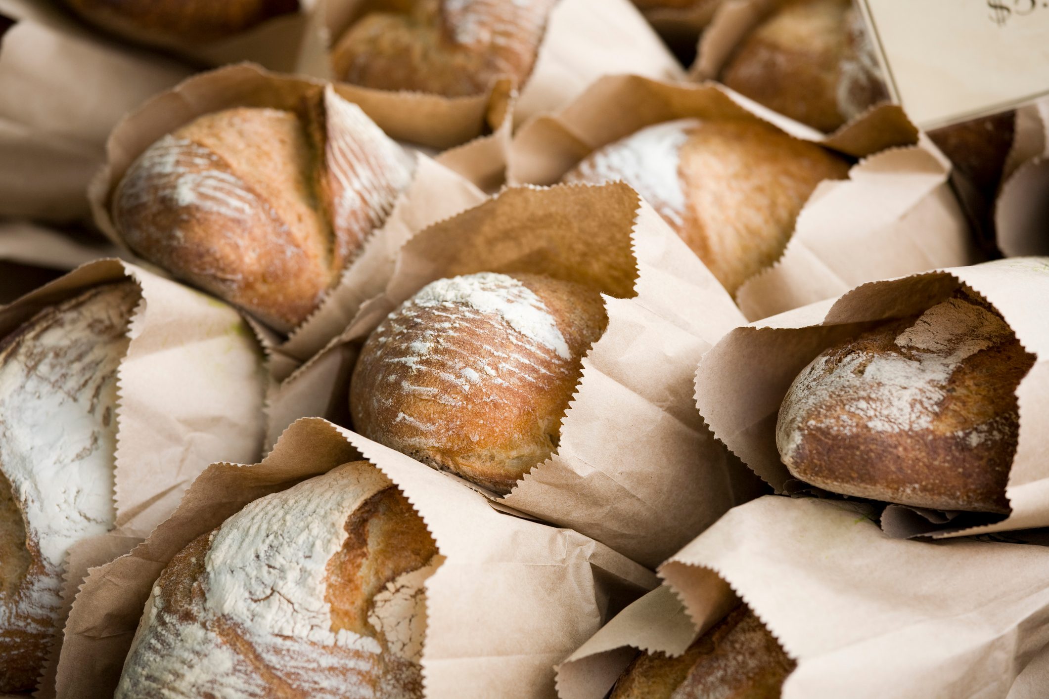 Freshly baked bread in bags at a farmers market