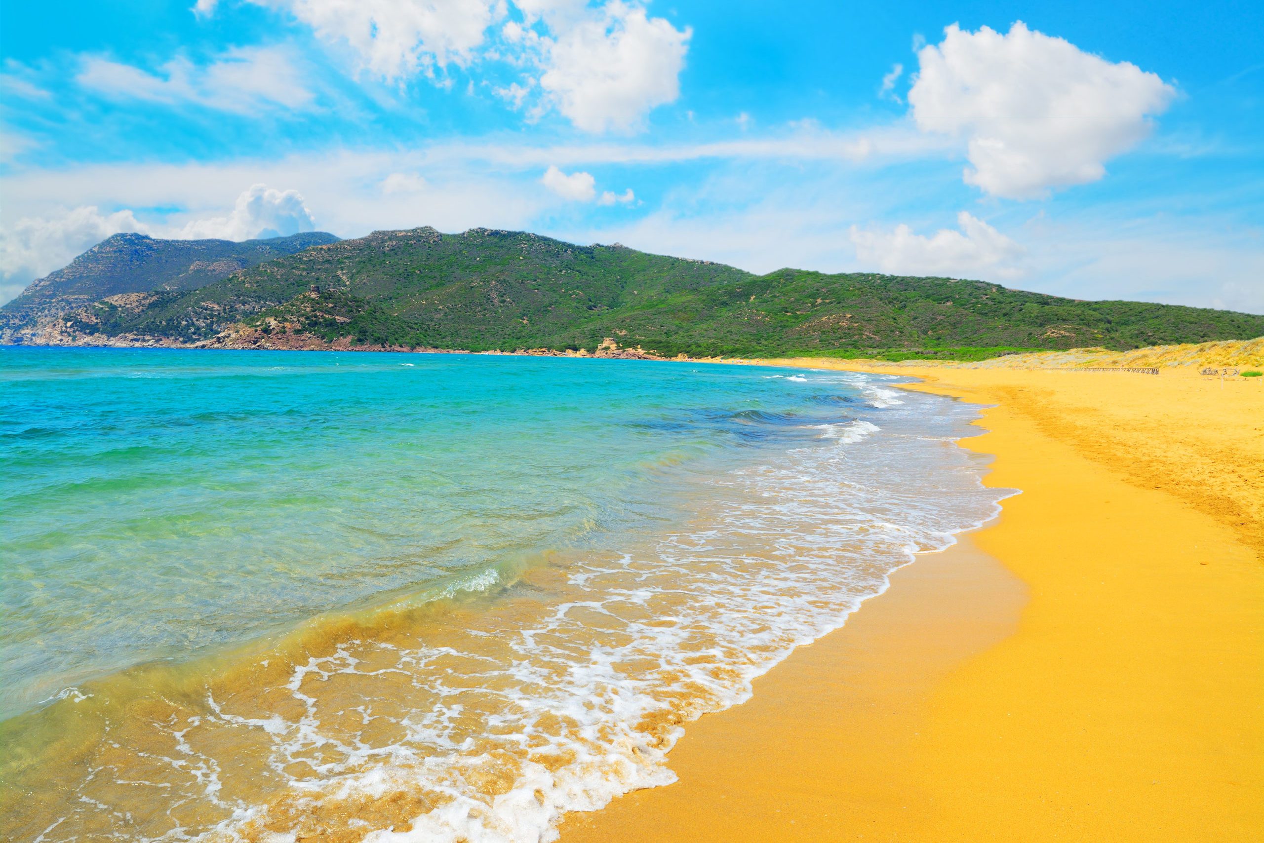 porto ferro beach on a cloudy day