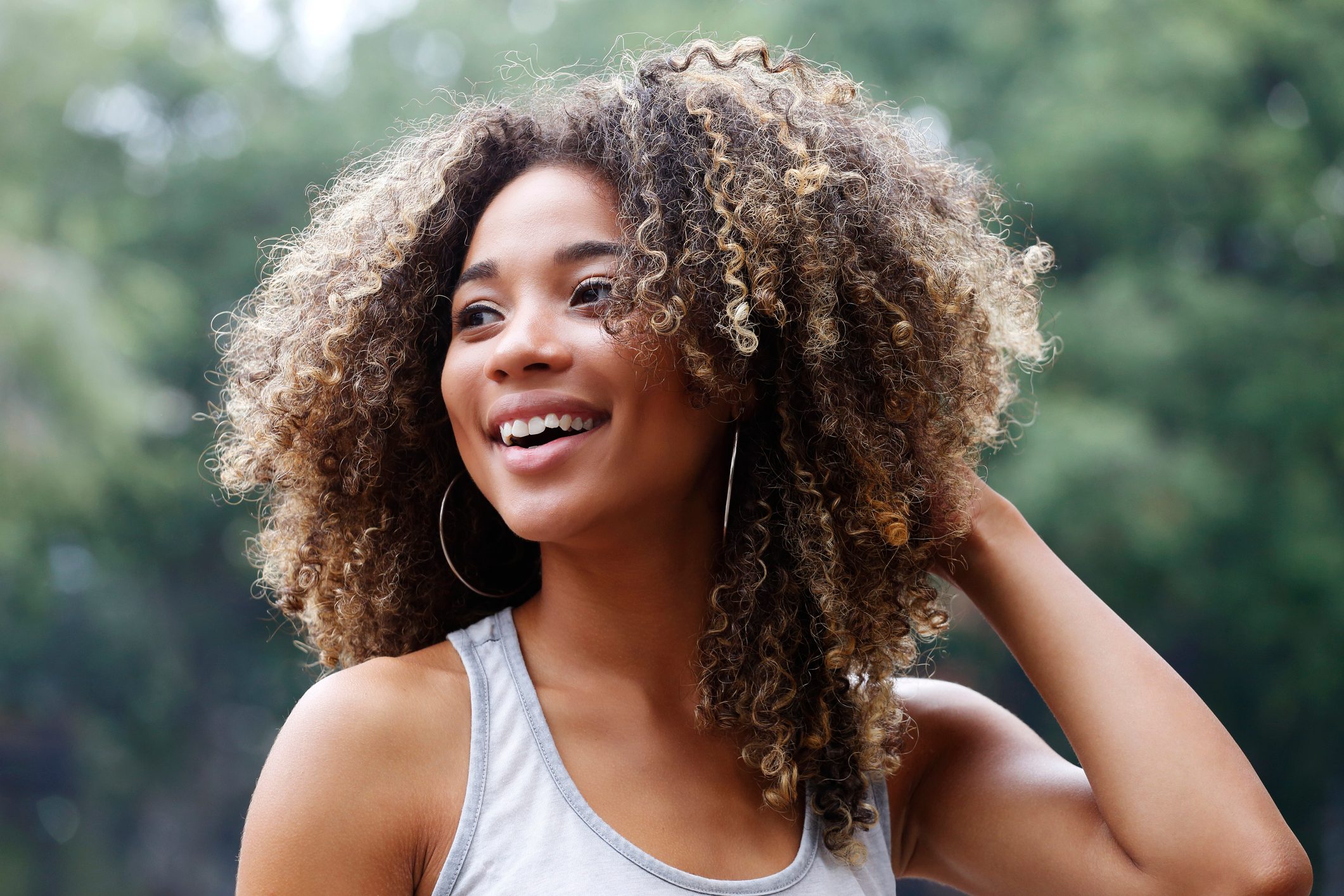 Young Latina woman laughing