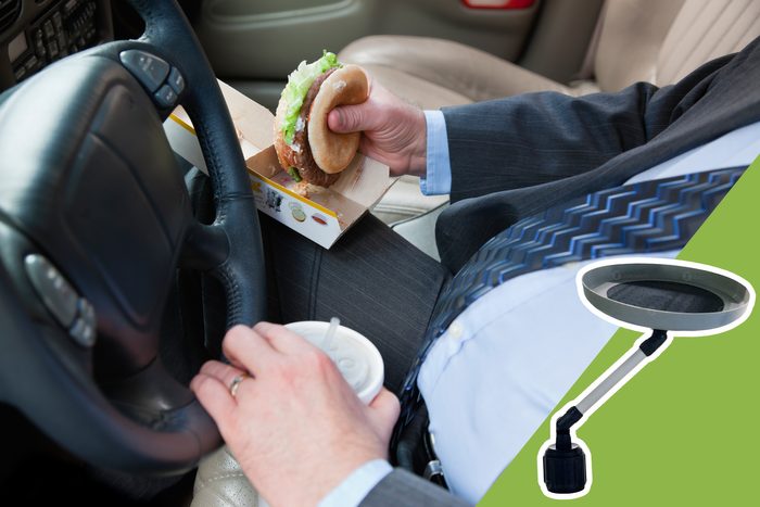 man eating in the car with inset of car tray