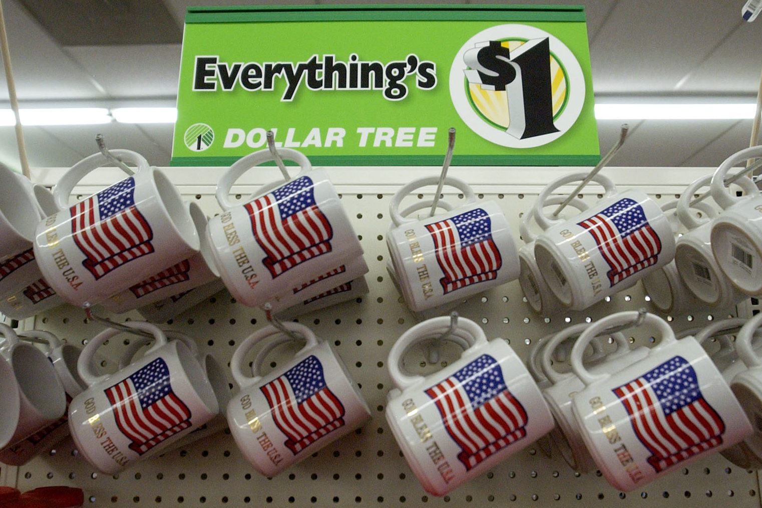 LITTLETON,COLORADO-May 12, 2004-The Dollar Tree store in Littleton is a popular place to shop. Everything costs $1.00. These $1.00 coffee mugs have an American flag and "God Bless the USA" printed under the flag. (DENVER POST PHOTO BY LYN ALWEIS) 8601 W.