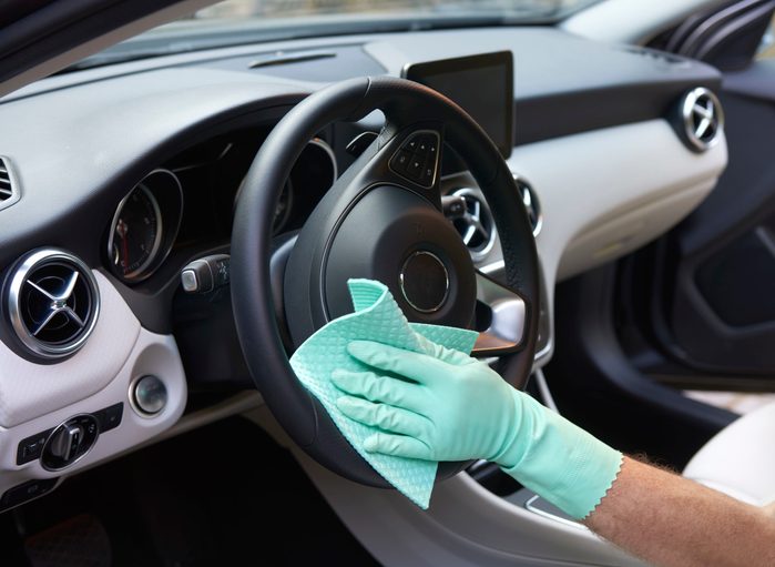 Dealer preparing car for sale