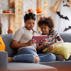 Mother and son looking for punny halloween costumes to wear