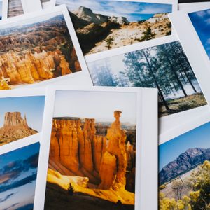 Collection of instant travel holiday photos on a table