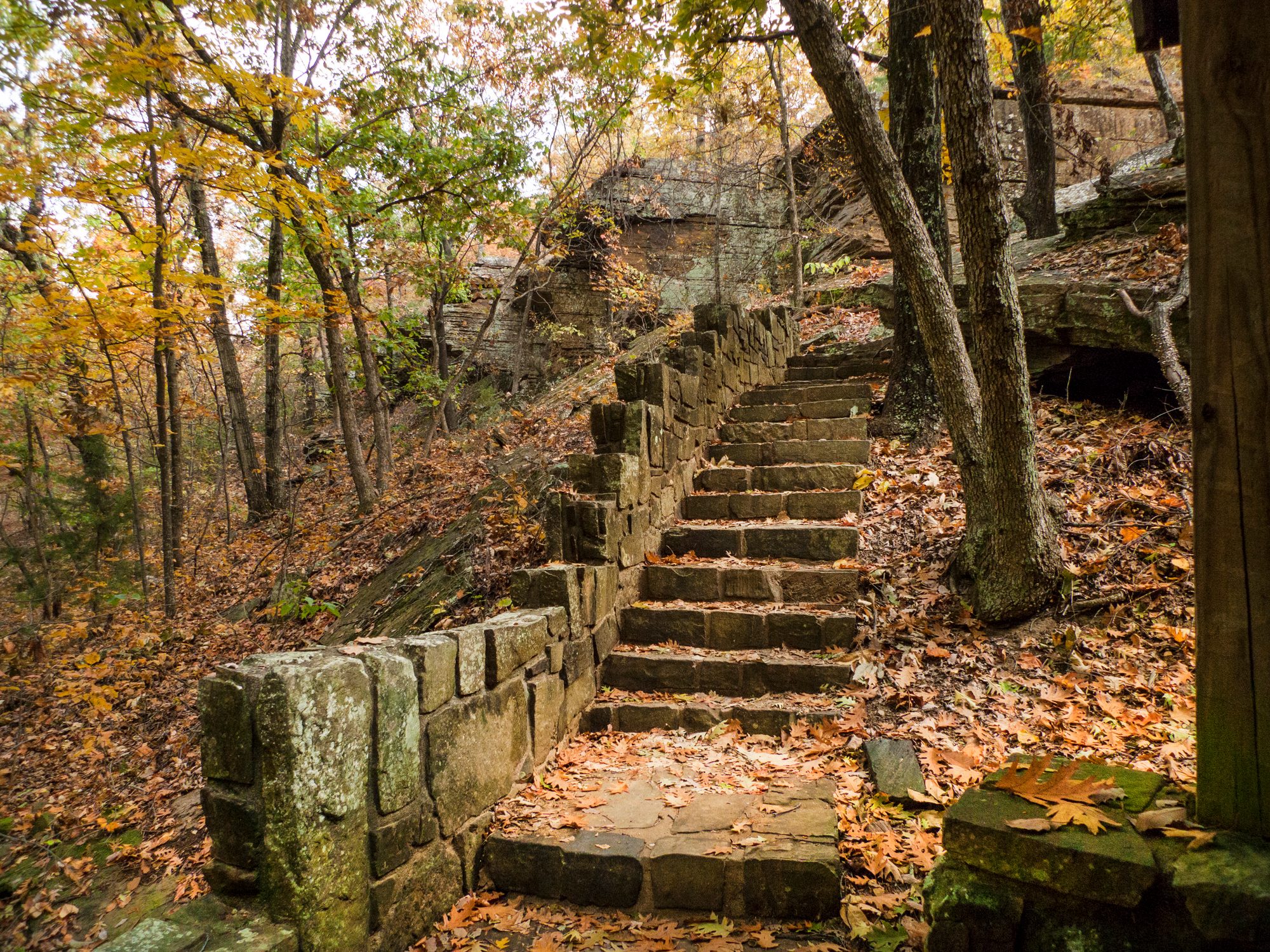 Mysterious stone staircase in an autumn forest