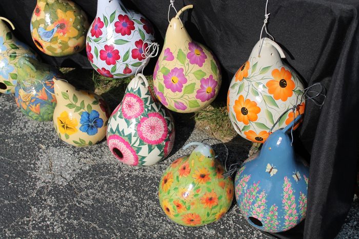 High Angle View Of Colorful Pumpkins Shaped Decorations On Road