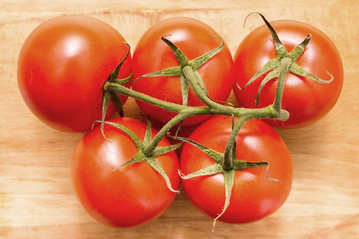 Red Tomatoes On Wooden Table