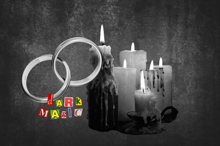 Wedding Bands Next To Candles With Text Dark Magic