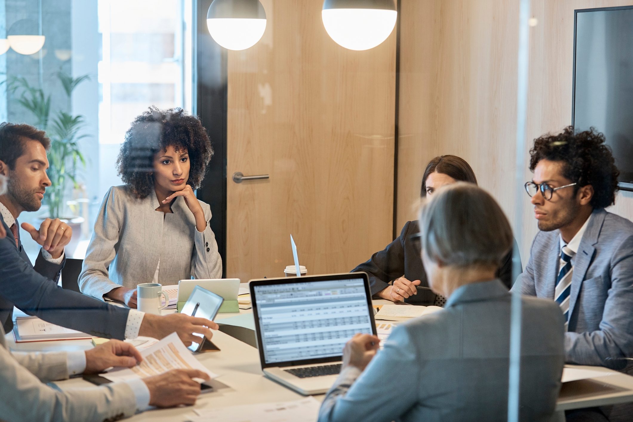 Multi-ethnic entrepreneurs sitting in board room