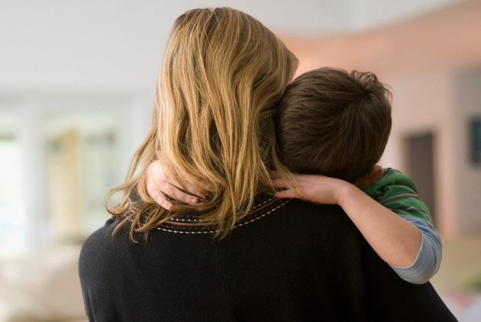 Caucasian mother comforting son