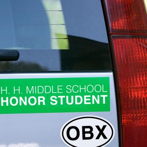 close up on the rear of a car with a two bumper stickers