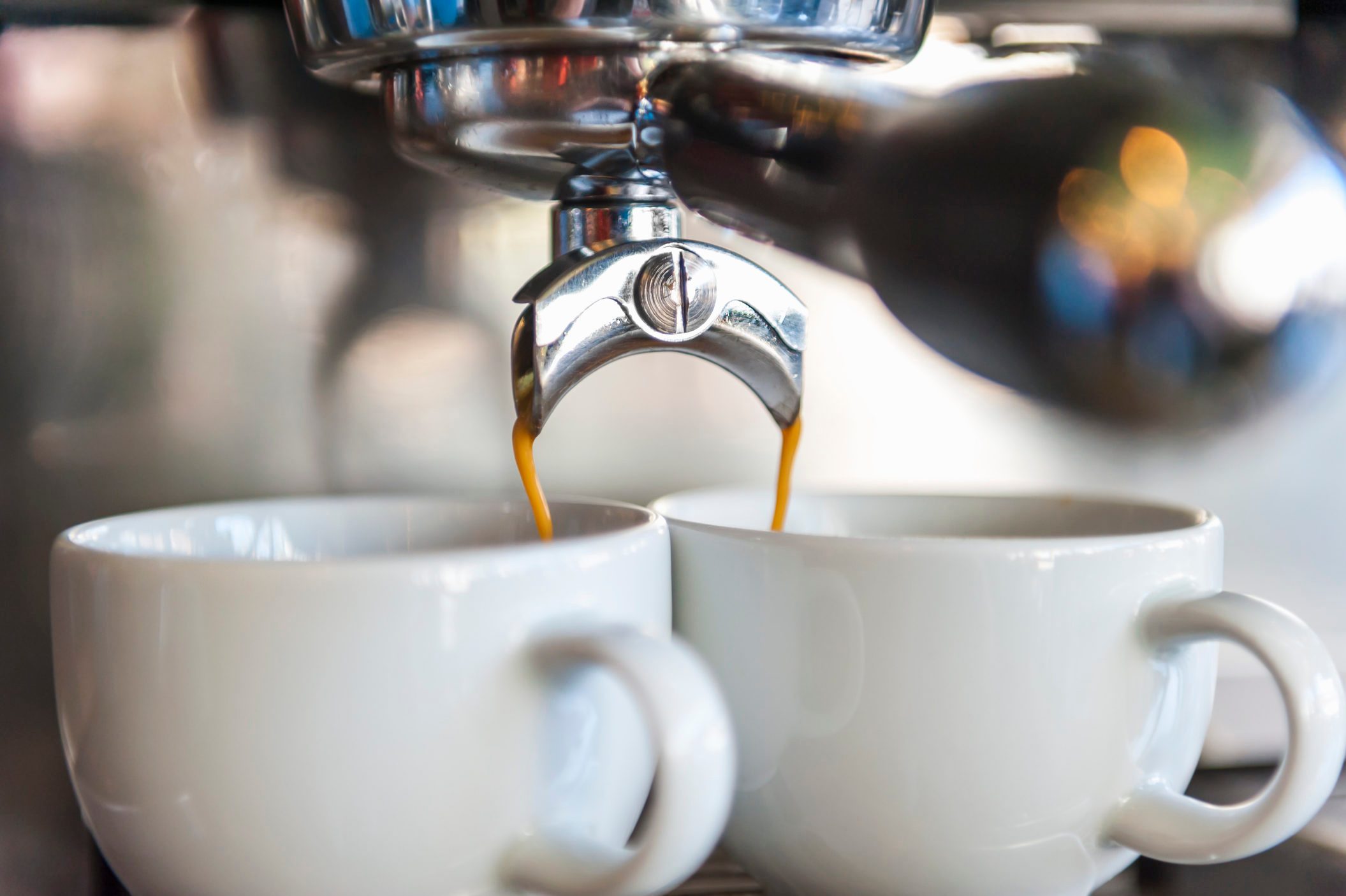 Coffee machine preparing two cups of coffee