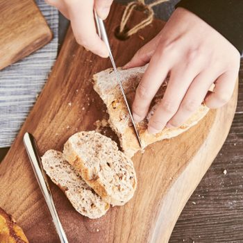 Woman Slicing Bread