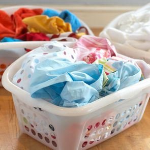 Clean washing in three plastic laundry baskets